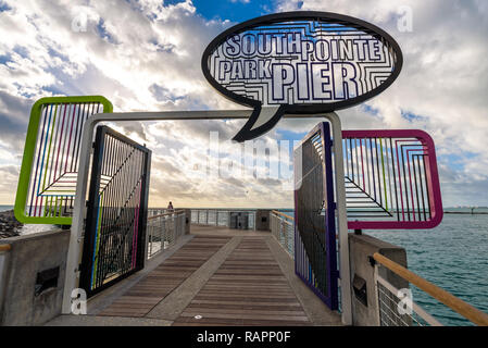 View of the entrance and sign of South Pointe Park Pier at sunrise, popular seafront spot for joggers, tourists and fishing in Miami Beach, Florida. Stock Photo