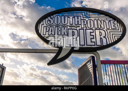 View of the entrance and sign of South Pointe Park Pier at sunrise, popular seafront spot for joggers, tourists and fishing in Miami Beach, Florida. Stock Photo
