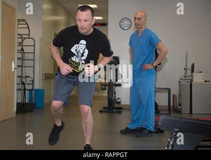 U.S. Navy Lt. Yui 'Tommy' Wong, a Doctor of Physical Therapy (DPT) with U.S. Naval Hospital Guam Stock Photo