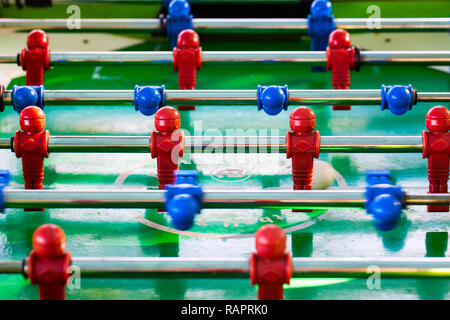 Sport Football Game Playing on Table Soccer controlling players with arms Stock Photo