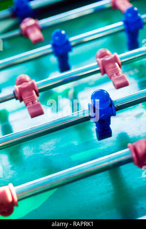Sport Football Game Playing on Table Soccer controlling players with arms Stock Photo