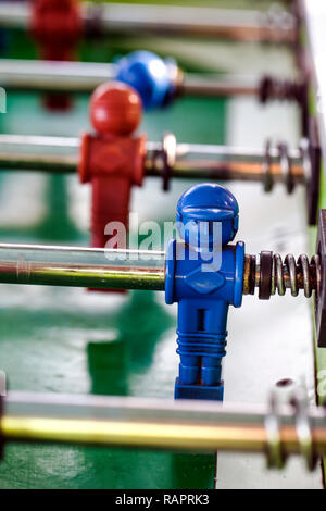 Sport Football Game Playing on Table Soccer controlling players with arms Stock Photo