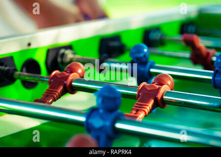 Sport Football Game Playing on Table Soccer controlling players with arms Stock Photo