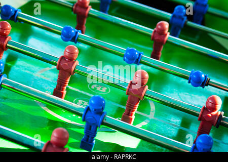 Sport Football Game Playing on Table Soccer controlling players with arms Stock Photo