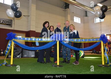 SILVERDALE, Wash. (Feb 28, 2017) – Capt. Alan Schrader (third from the right), Naval Base Kitsap (NBK) commanding officer, and the Navy Operational Fitness and Fueling Systems (NOFFS) facility staff prepare to cut the ribbon, commemorating the newest addition to NBK’s mission for fitness. Stock Photo