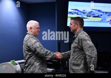 Lt. Gen. L. Scott Rice, Director of the Air National Guard, recognizes Capt. Peter Hickman, 225th Air Defense Squadron, for recently being named a U.S. Air Force Weapons School Top Graduate and First Air Force Command and Control Warrior of the Year. Rice spent the day visiting two Washington Air National Guard units: the Western Air Defense Sector at Joint Base Lewis-McChord and the 194th Wing at Camp Murray. Stock Photo