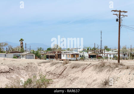 MAY 15 2015 - BOMBAY BEACH, CA: Abandoned trailers and homes in Bombay Beach, California, near the Salton Sea Stock Photo