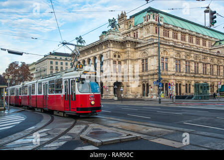 A red tram passes the State Opera House on Ringstrasse, Vienna, Austria. Stock Photo