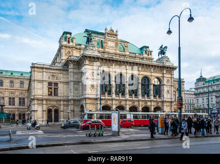 A red tram passes the State Opera House on Ringstrasse, Vienna, Austria. Stock Photo