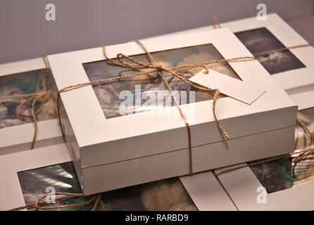 packed boxes with cookies tied with rope Stock Photo