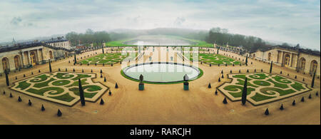 Panorama of Versailles Palace Gardens near Paris, France. Greenhouse Park against the background of the Swiss basin. The Orangerie as world heritage. Stock Photo