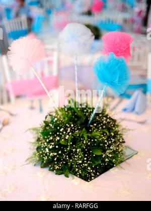 MERIDA, YUC/MEXICO - NOV 18, 2017: Twin babies's baptismal party venue decoration and gifts for guests. Centerpiece Stock Photo