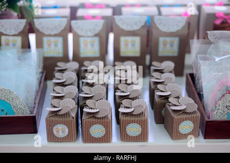 MERIDA, YUC/MEXICO - NOV 18, 2017: Twin babies's baptismal party venue decoration and gifts for guests. Cardboard boxes Stock Photo