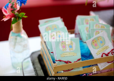 MERIDA, YUC/MEXICO - NOV 18, 2017: Twin babies's baptismal party venue decoration and gifts for guests. Thank you cards Stock Photo