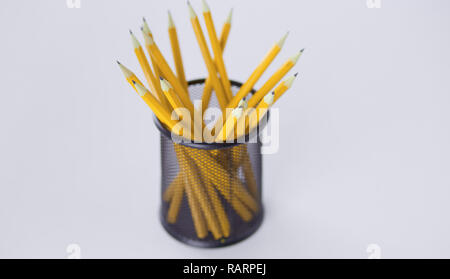 Graphite pencils in a metal grid-container. Concept. Stock Photo