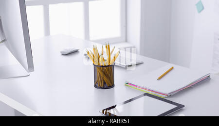Graphite pencils in a metal grid-container. Concept. Stock Photo