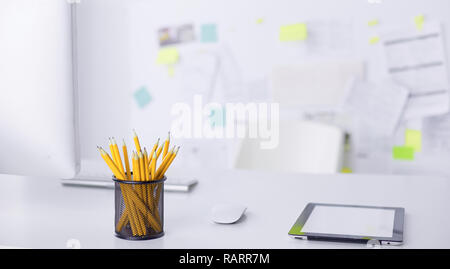 Graphite pencils in a metal grid-container. Concept. Stock Photo