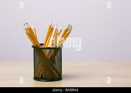 Graphite pencils in a metal grid-container. Concept. Stock Photo