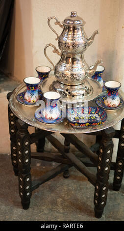 traditional turkish tea silverware utensil set on small vintage coffee table Stock Photo