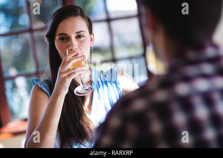 Couple drinking white wine in restaurant Stock Photo