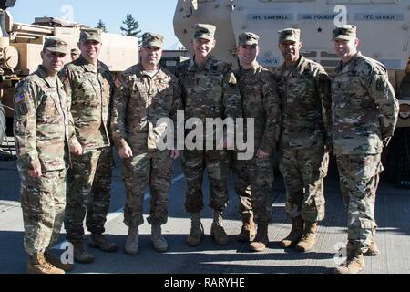 From left to right: Command Sgt. Major Jerry Morales and Lt. Col. Frank Buchheit, of 1-94 Field Artillery Regiment,  Sgt. 1st Class Zachery Wilkerson, A Battery, 1-94 FAR, 17th Field Artillery Brigade,  Lt. Gen Stephen R. Lanza, I Corps,  Cpt. Jamie Holm, A Battery, 1-94 FAR, 17th FA Brigade, Col. Andrew Gainey and Command Sgt. Major Joe Winstead, 17th FA Brigade, pose for a photo on Joint Base Lewis-McChord, Wash., Feb. 13, 2016. Wilkerson was recognized for winning the U.S. Army Field Artillery's Gruber Award. Established in 2002, the Gruber Award is presented to an individual artillery Sold Stock Photo
