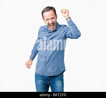 Handsome middle age elegant senior man over isolated background Dancing happy and cheerful, smiling moving casual and confident listening to music Stock Photo