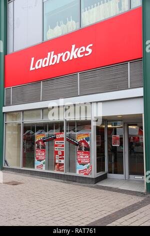 BIRMINGHAM, UK - APRIL 24, 2013: Ladbrokes betting and gaming shop in Birmingham, UK. Ladbrokes has 2,400 retail betting shops in the UK and Ireland. Stock Photo