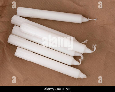 https://l450v.alamy.com/450v/ratbme/traditional-white-household-wax-candles-with-brown-paper-packaging-emergency-lighting-electricity-backup-ratbme.jpg