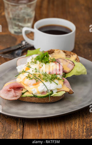 closeup of a eggs benedict with coffee Stock Photo