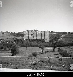 1940s, Jerusalem and 'The Mount of Olives' as seen in this era. The hill or mounain ridge gets its name from the olive groves that covered its slopes and is famous for the many biblical events that have taken place over the centuries. Referenced in both the Old and New testaments of the Bible, the mount is considered a sacred spot and of great religious and cultural  significance. Stock Photo