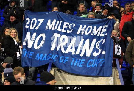 Tottenham Hotspur fans hold up a flag during the Emirates FA Cup, third round match at Prenton Park, Birkenhead. Stock Photo