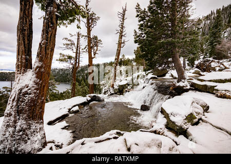 Lower Eagle falls on a cloudy winter day, Emerald bay and Lake Tahoe visible in the background Stock Photo