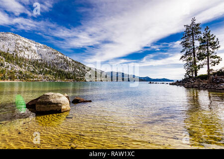 Sunny winter day on the shoreline of Lake Tahoe, Sand Harbor State Park, Sierra mountains, Nevada Stock Photo