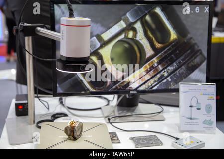 Bangkok, Thailand - November 23, 2018: Surface roughness evaluation of engine cylinder by optical microscope display in Metalex 2018 Stock Photo