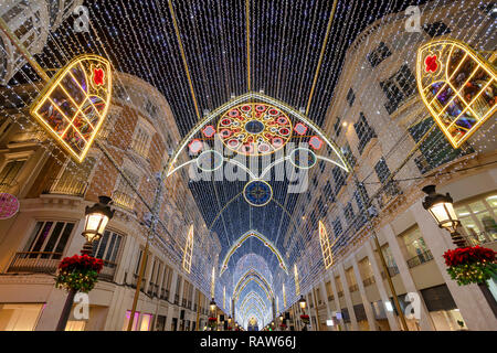 Christmas decorations on Calle Marques de Larios street in the centre of Malaga city, Andalusia, Spain. Most popular pedestrian street of Malaga Stock Photo