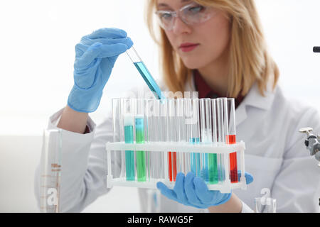 Technician hold in arms in protective gloves Stock Photo
