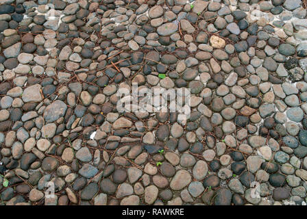Small stone arrangement for the path in the park. Stone walkway Stock Photo
