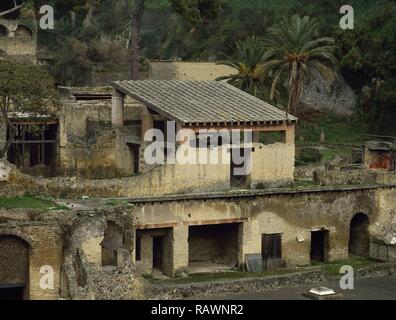 Italy. Herculaneum. Ancient Roman city destroyed by the eruption of the Vesuvius in 79 AD. House of the Gem (Casa della Gemma). Located at the southern end of Cardo V. Two-story house. General view. Campania. Stock Photo