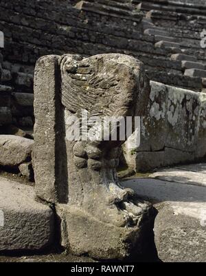 Italy. Pompeii. Ancient Roman city destroyed by the eruption of the Vesuvius in 79 AD. Small Theatre or Odeon, built in 80 BC. Remains of a balustrade with a winged gryphon (lion's paw). Area of Ima cavea reserved to decurions. Campania. Stock Photo