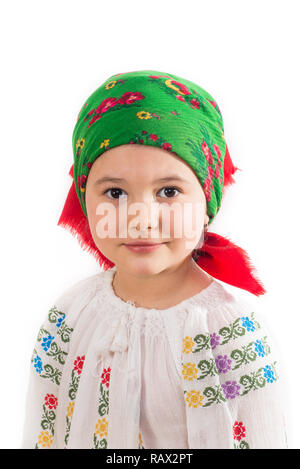 Closeup of a young girl with head dressed in traditional costume. Romanian folklore. Posing in a studio on a white background. Stock Photo
