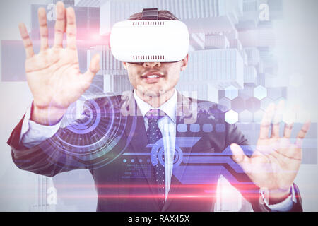 Composite image of businessman gesturing while wearing vr glasses Stock Photo