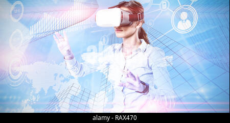 Composite image of female executive using virtual reality headset Stock Photo