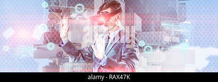 Composite image of businessman using virtual reality headset Stock Photo