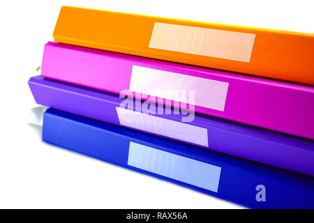 File Folder Binder stack of multi color on table in office. Stock Photo