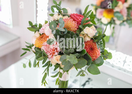 bright wedding bouquet of summer dahlias and roses Stock Photo