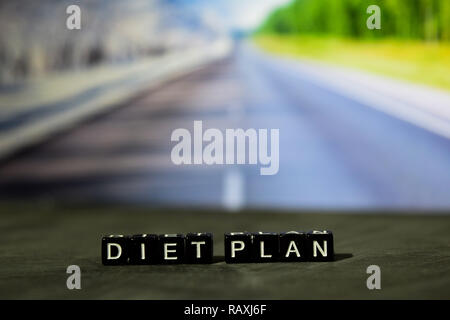 Diet plan on wooden blocks. Cross processed image with bokeh background Stock Photo