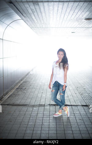 Asian female model poses for pictures on the street Stock Photo