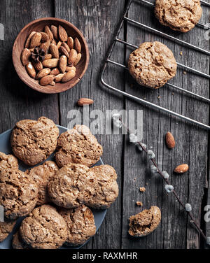 Homemade almond cookies on grey wooden table at rustic kitchen Stock Photo