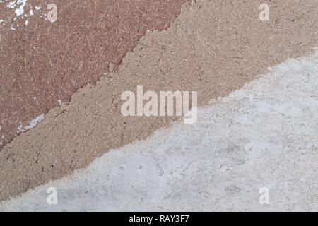 Clay and straw plaster on wall as texture/background Stock Photo