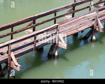 Old Wooden Bridge over Green Water Aerial Perspective Stock Photo